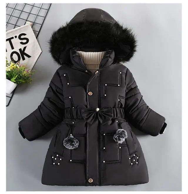 Black winter coat with fur hood on a light gray background