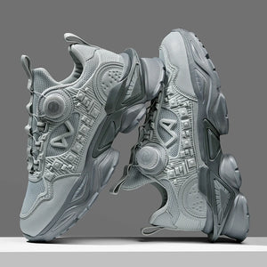 Gray sneakers with geometric patterns on a gray background