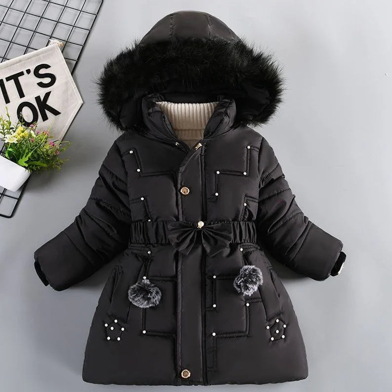 Black winter coat with fur hood on a light gray background
