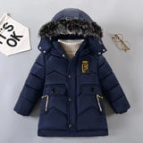 Navy blue children's puffer jacket with fur hood on a light gray background