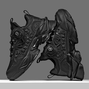 Black high-top sneakers with intricate design on a gray background