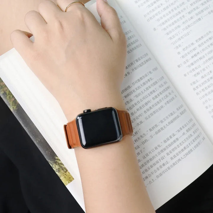 Stylish genuine leather Apple Watch band with magnetic loop closure, available in multiple colors.