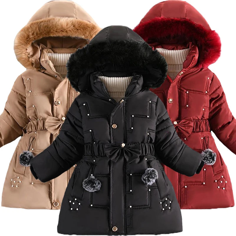 Three winter jackets in black, beige, and red with fur-lined hoods on a white background.