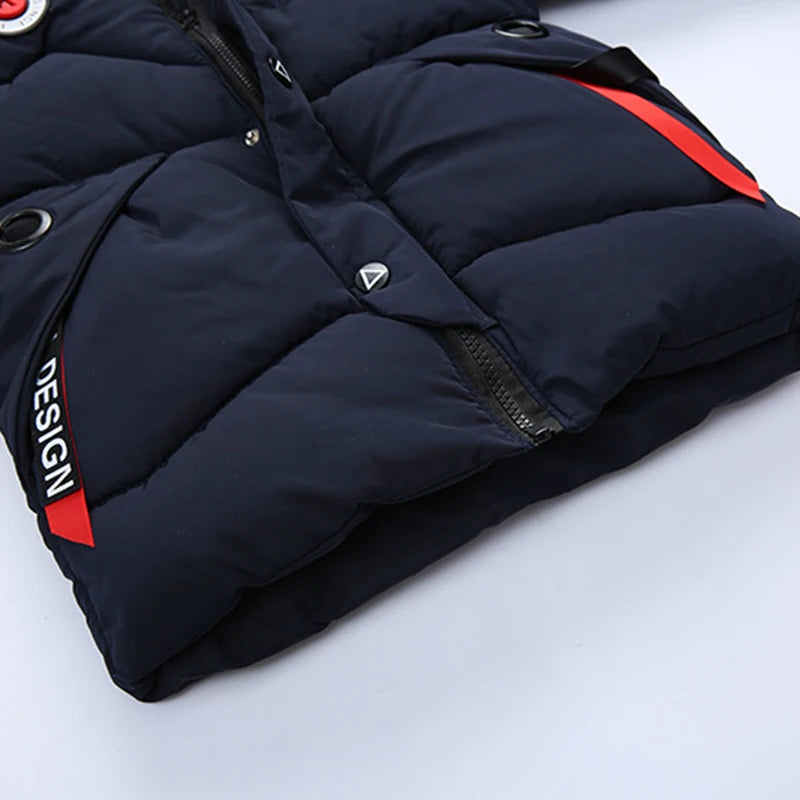 Navy blue puffer jacket with red accents on a light gray background