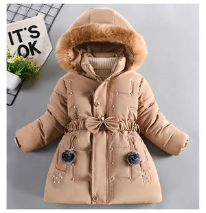 Beige winter coat with fur-lined hood on a gray background