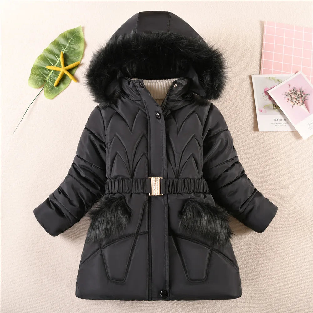 Black winter coat with fur hood and trim on a light background