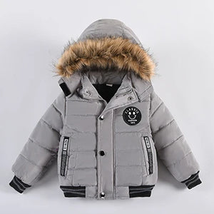 Gray children's winter jacket with fur-lined hood on a white background