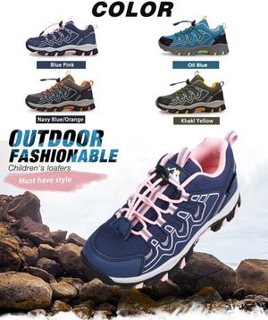 Children's outdoor fashion shoes in various colors with a prominent navy blue and pink shoe on rocks.