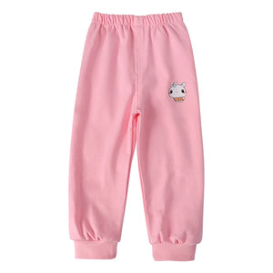Pink sweatpants with a small cartoon character on a white background