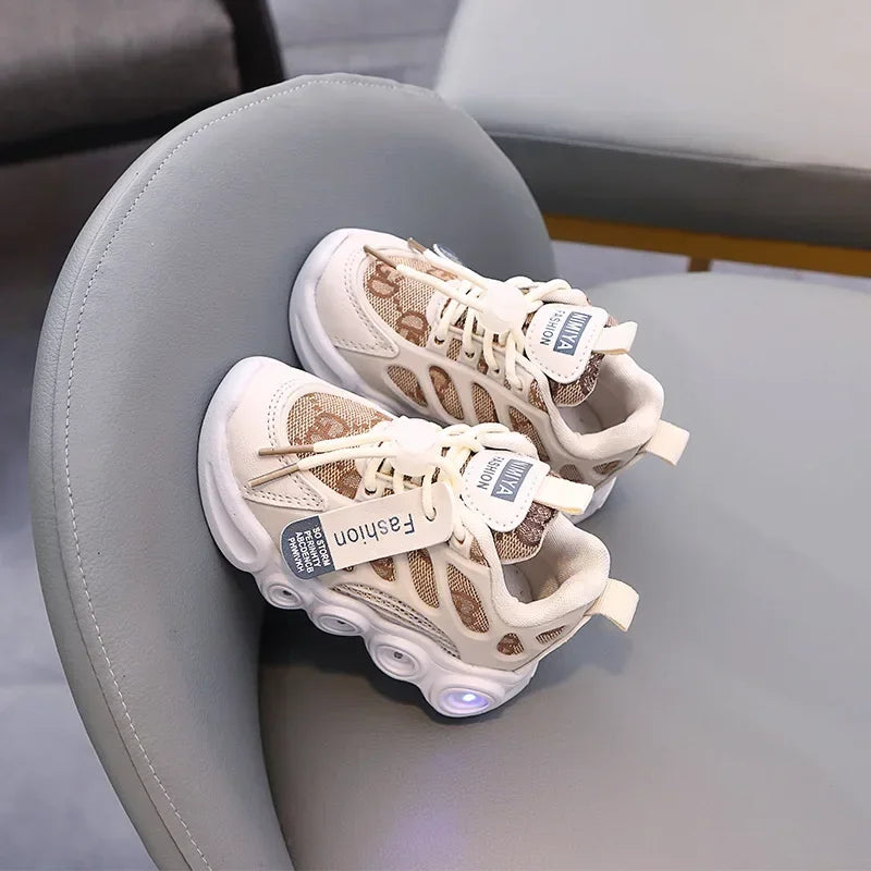 Pair of beige sneakers with LED lights on a gray chair