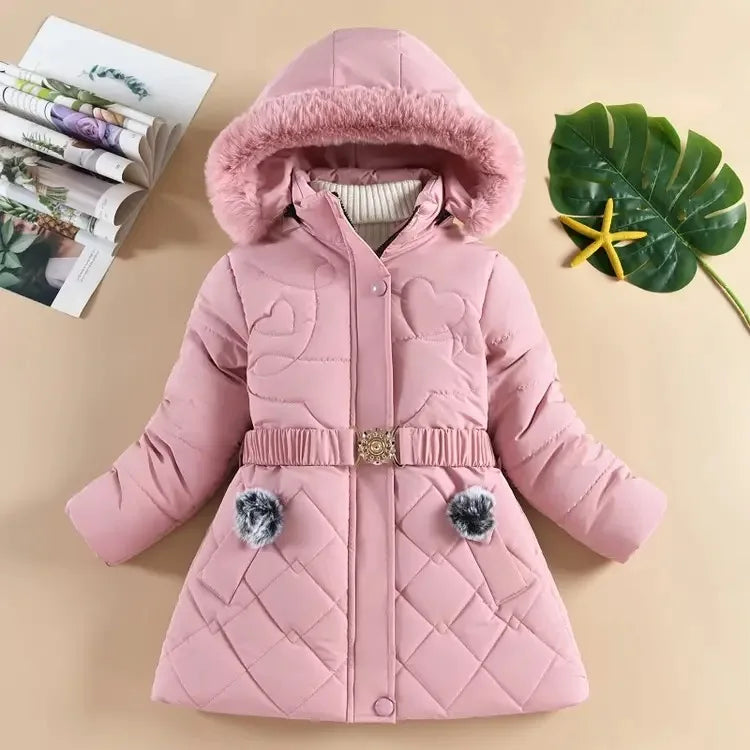 Pink children's coat with fur hood on a beige background