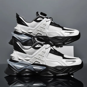 Pair of black and white sneakers on a reflective surface with a gray background