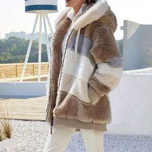 Person wearing a patchwork faux fur coat with a blurred outdoor background