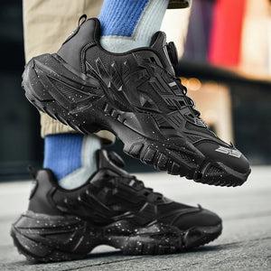 Black sneakers worn with blue socks on a blurred street background