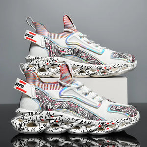 White sneakers with black and red patterns on a reflective surface and gray background