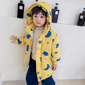 Child wearing a yellow coat with blue patterns against a white background