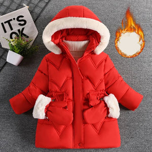 Red children's winter coat with white fur trim on a gray background