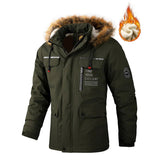 Green winter jacket with fur hood and brand logo on a white background