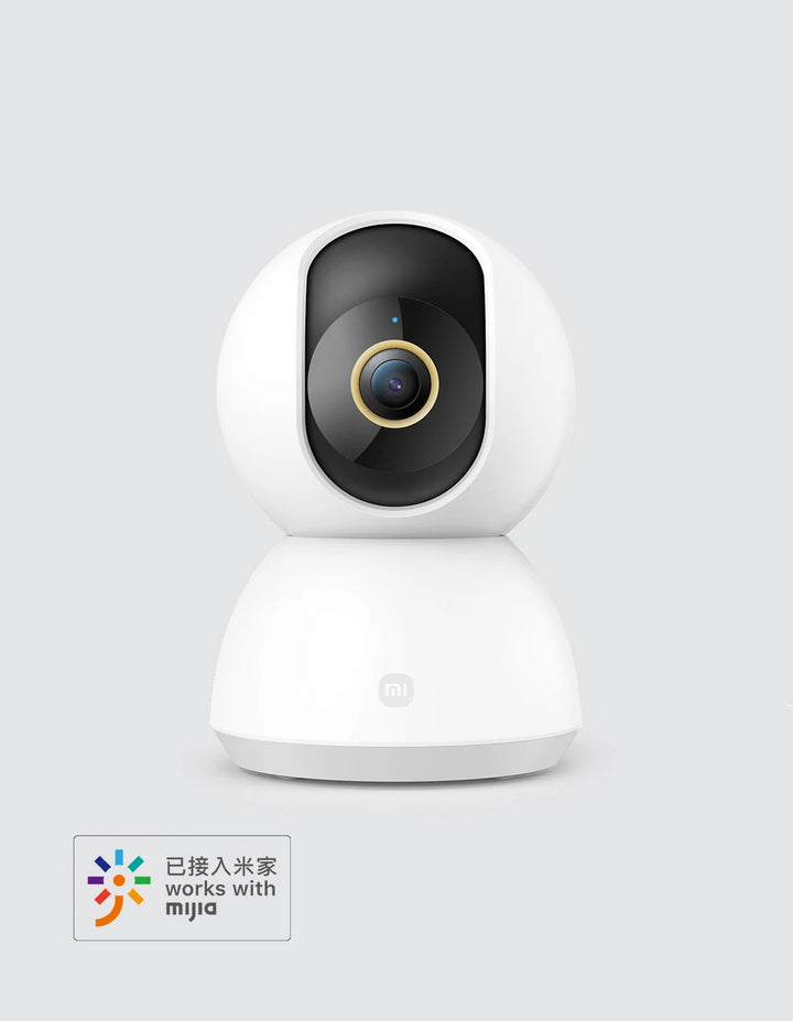 White security camera with a black lens on a light gray background, featuring the Mijia logo.