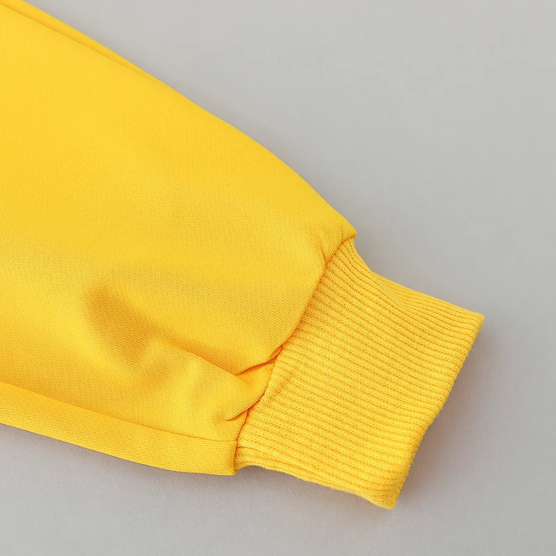Close-up of a yellow sleeve on a gray background