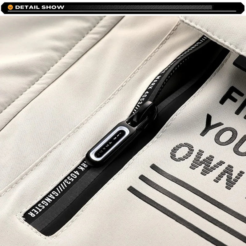 Close-up of a black zipper on a white jacket with text.