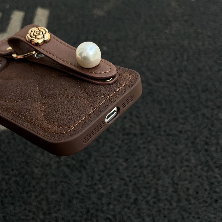 Luxury PU Leather Down Jacket Phone Case with Flower Wrist Strap for iPhone 15 Pro Max