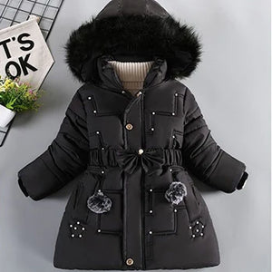Black winter coat with fur hood on a gray background