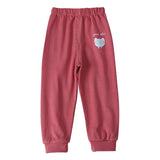 Red sweatpants with a small graphic and text on a white background