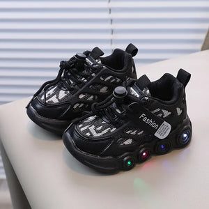 Black sneakers with LED lights on a light surface