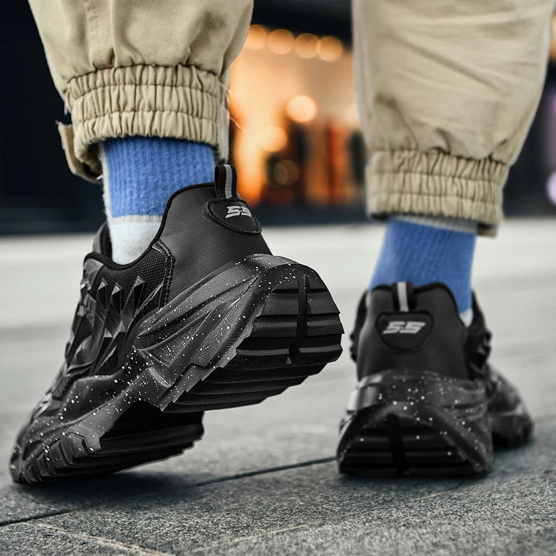 Black sneakers with a brand logo worn on a blurred street background