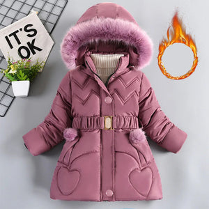 Pink children's winter coat with fur hood on a gray background