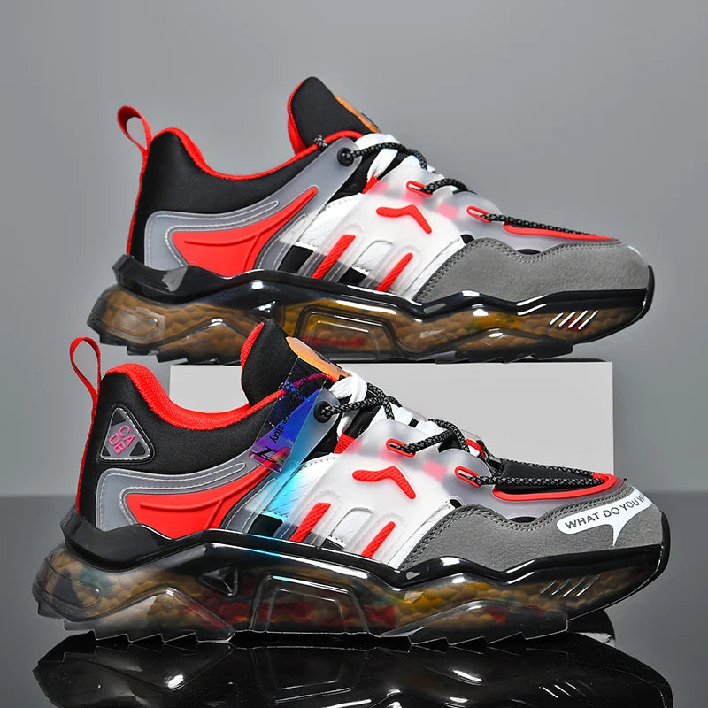 Pair of black, gray, and red sneakers on a reflective surface with a gray background