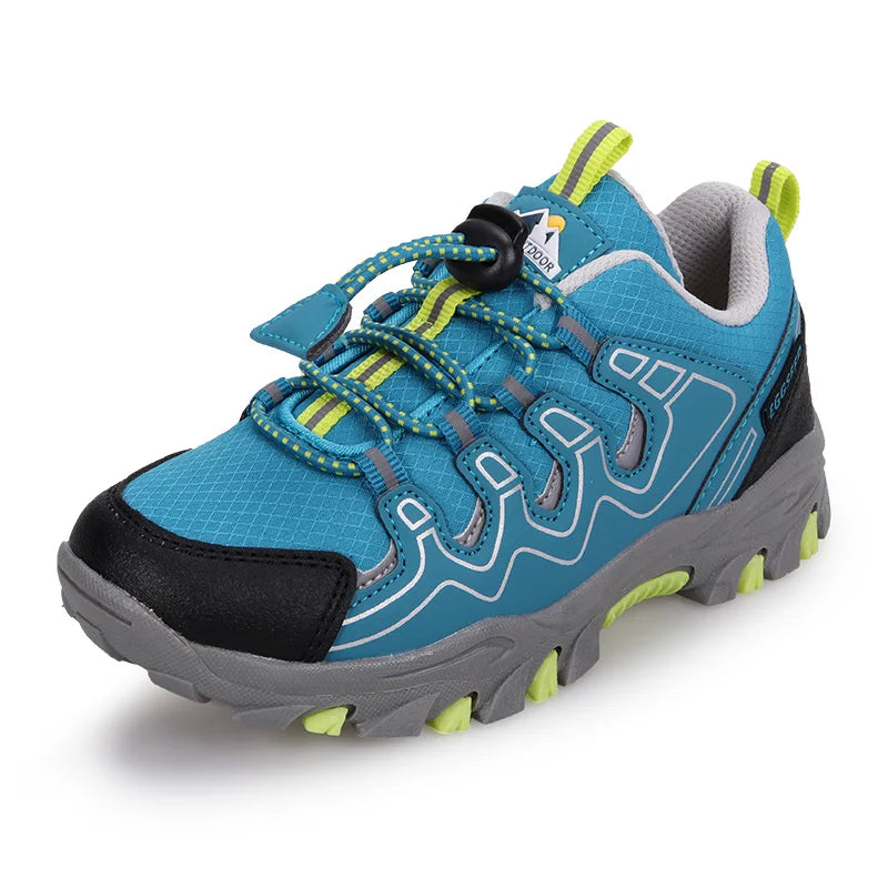 Blue children's sneaker with gray sole and green accents on a white background