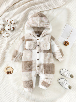 Plaid baby onesie with hood on a soft white background