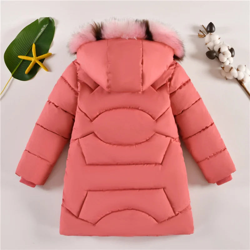 Pink children's puffer jacket with fur hood on a light gray background