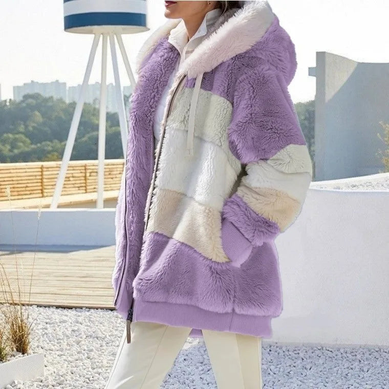 Person wearing a colorful faux fur coat with a blurred outdoor background